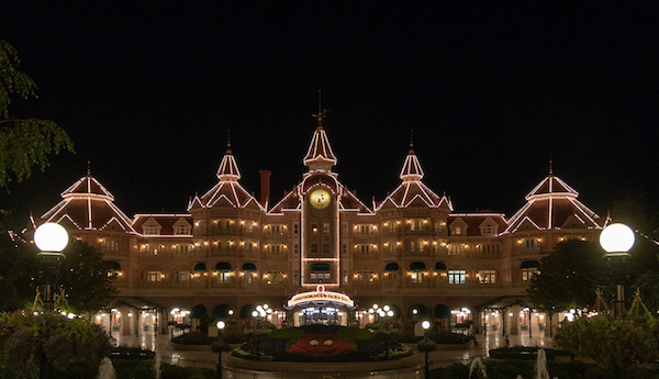 How To Plan For The Best Disneyland Paris Trip Ever, Disneyland Hotel by night at Disneyland Paris