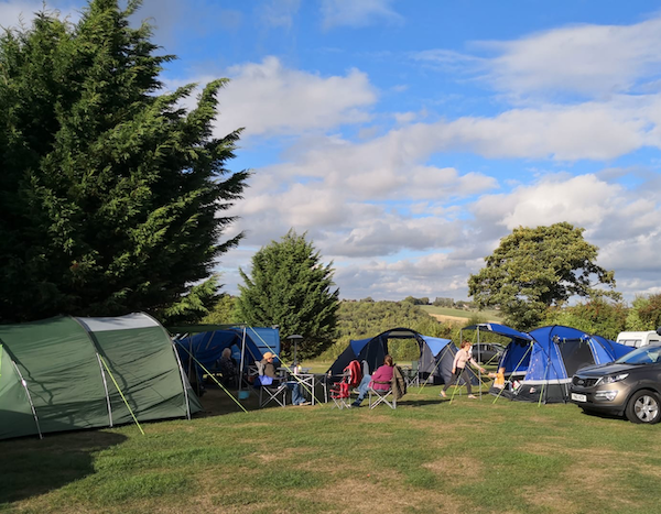 September 2018 Income & Profit Report update, our group of tents pitched at the campsite