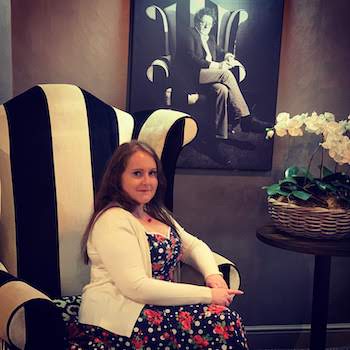 October 2018 Income & Profit Report, Corinna sat in front of a picture of Marco Pierre White