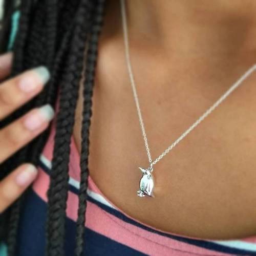 Woman wearing Jana Reinhardt penguin pendant