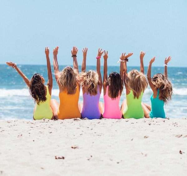 Ladies sitting on a beach in summer