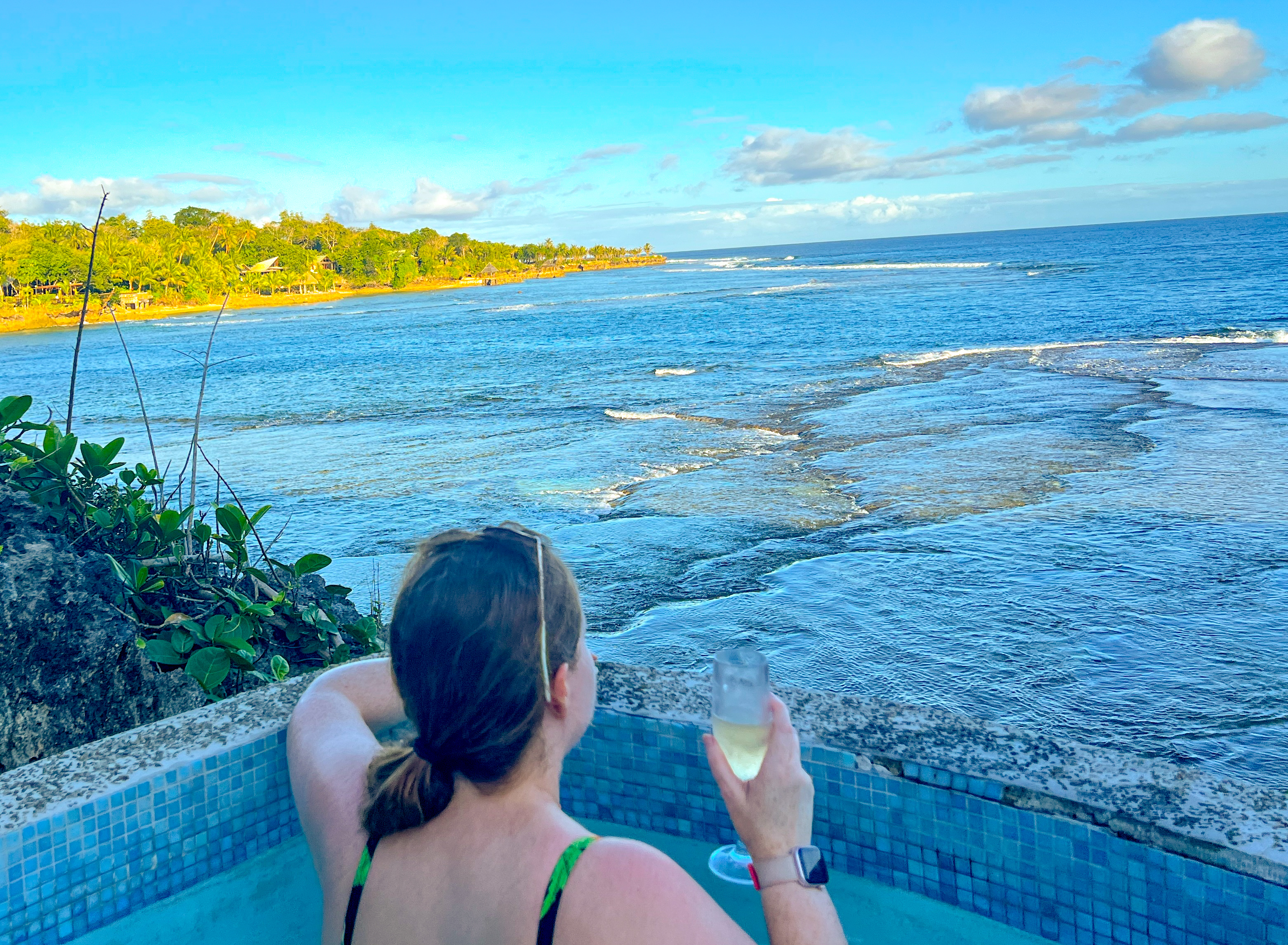 Corinna in hot tub overlooking sea in Fiji